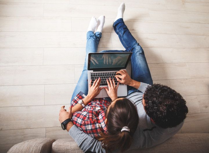 couple using laptop computer