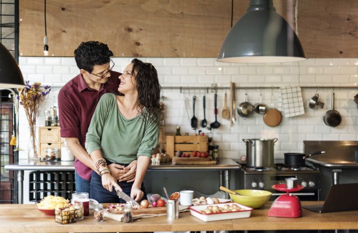 couple cooking in kitchen