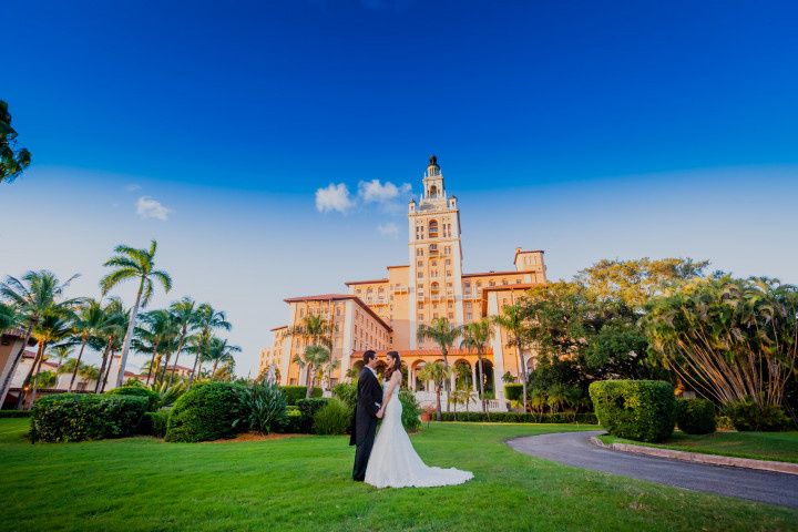 couple with wedding hotel backdrop 