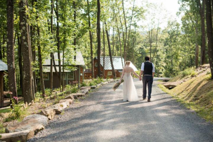 couple walking together in rustic woods