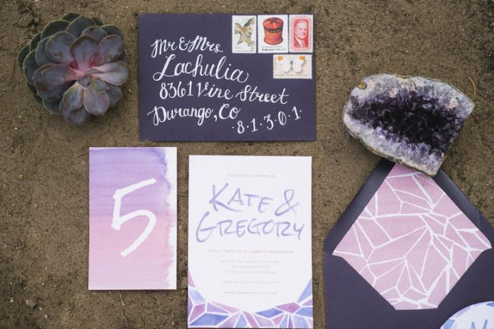 modern bohemian wedding invitations with purple watercolor geode and triangle pattern