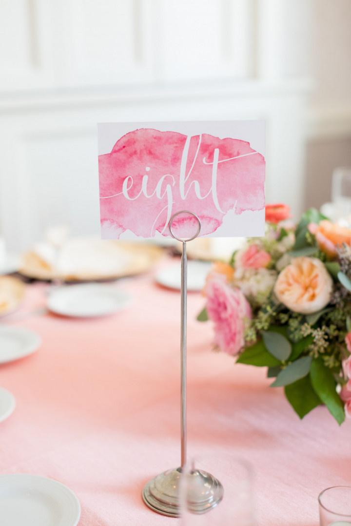 pink watercolor table number for wedding reception centerpiece