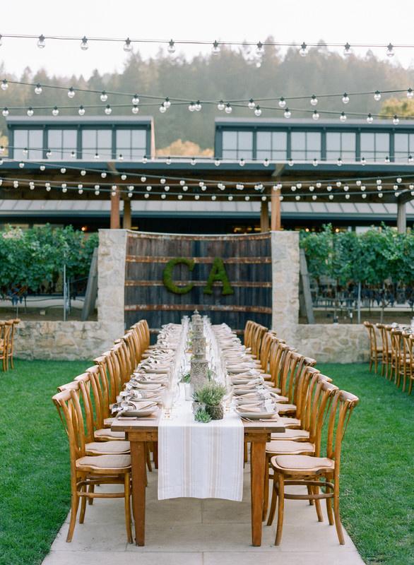 outdoor reception venue in Napa Valley with long banquet table and string lights