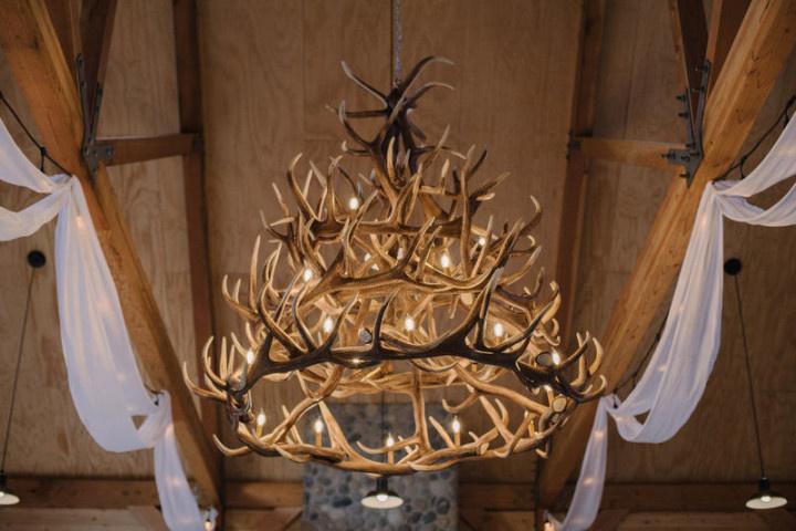 rustic antler chandelier at barn wedding venue