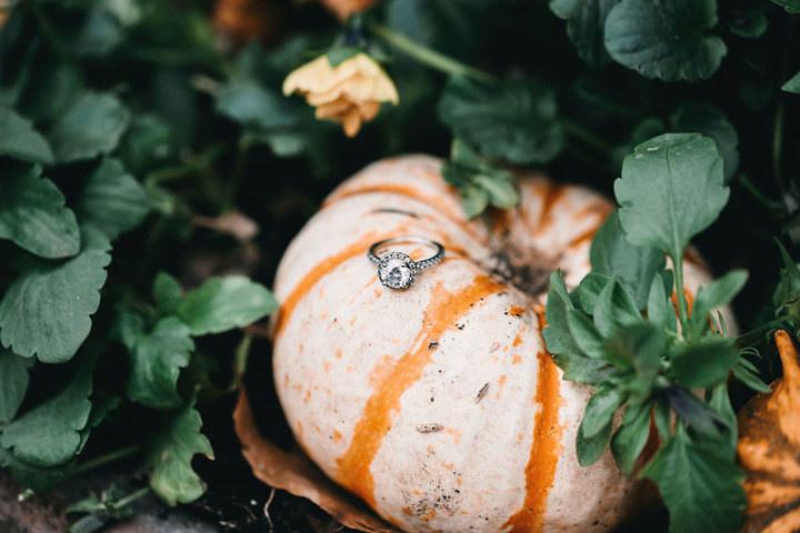 fall engagement ring idea with mini pumpkin