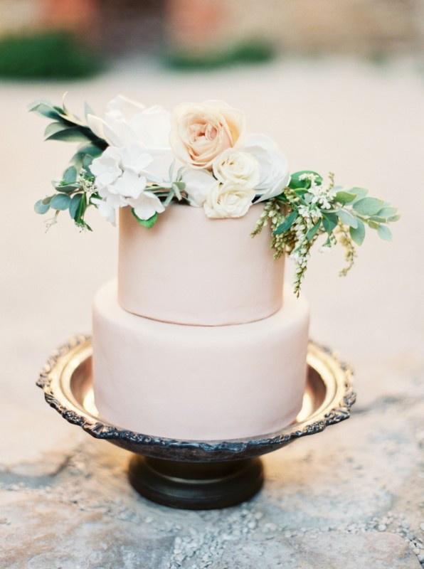 blush wedding cake with greenery