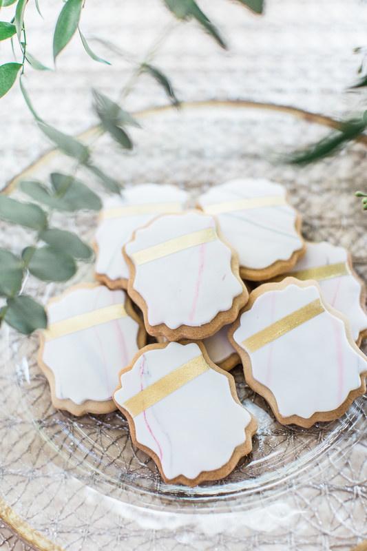 custom wedding cookies with royal icing and edible gold foil design