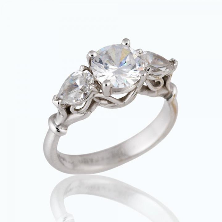 round stone and three stone setting engagement ring