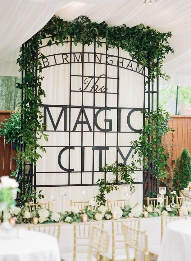 wedding reception in birmingham, AL with head table and magic city sign