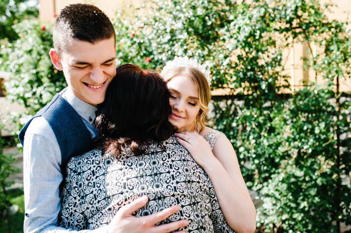 couple hugging mom