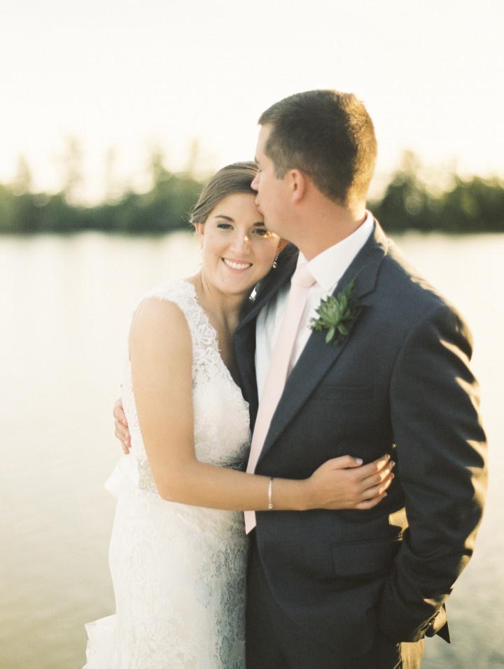 bride and groom hugging 