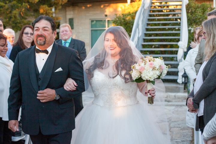 bride and father walking down the aisle 