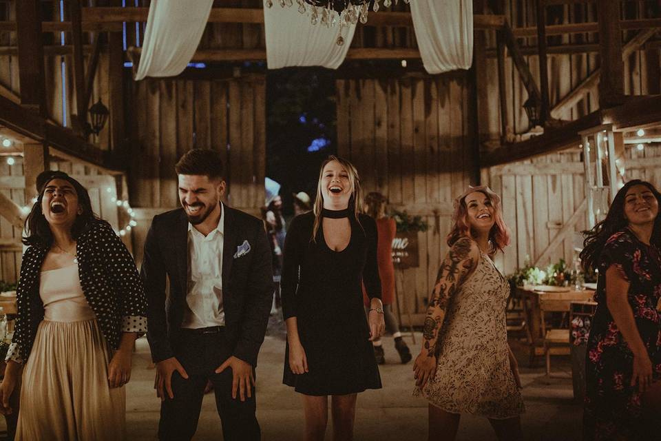 guests dancing at a barn wedding
