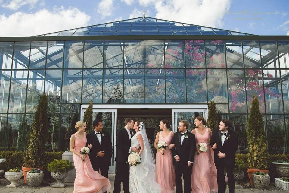 wedding party outside greenhouse venue