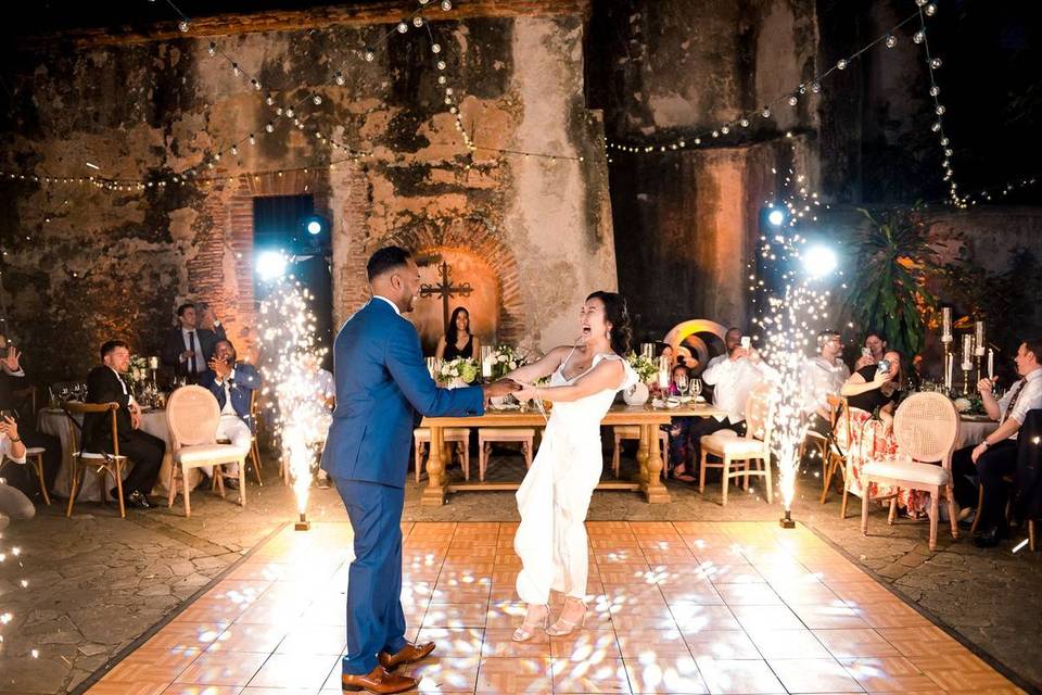 couple performing first dance amid fireworks