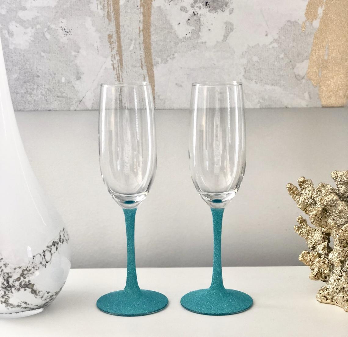 Wedding champagne glasses with colorful glittery stems