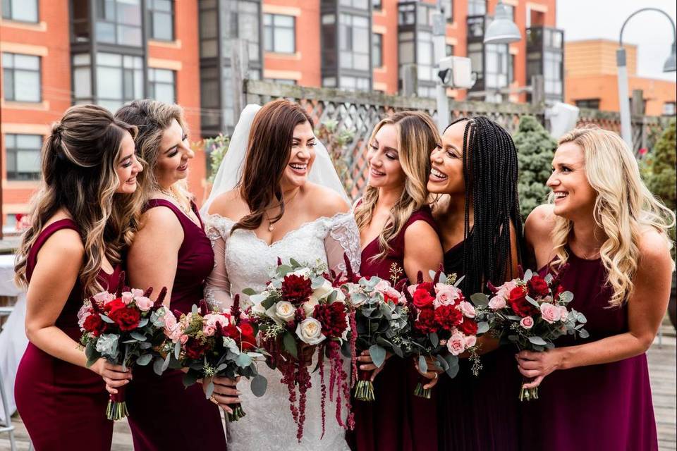 bride with bridesmaids laughing
