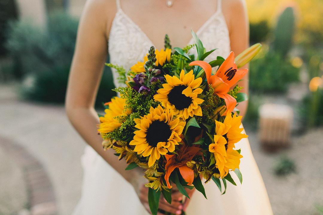 colorful sunflower wedding bouquet with orange tiger lilies, yellow alstroemeria and greenery