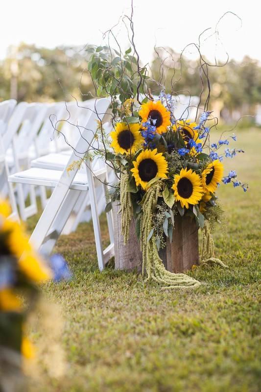 sunflower wedding ceremony decor at the start of the aisle