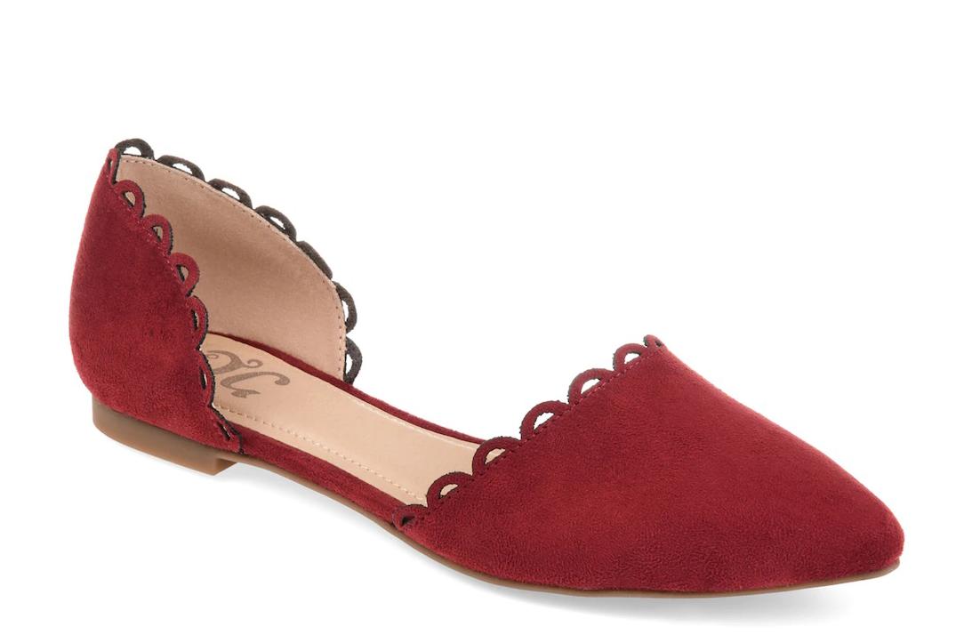 Red suede flats with cutouts and scalloped trims