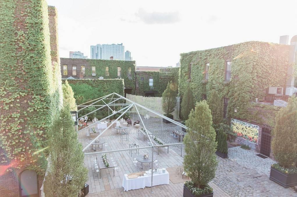 outdoor event space with clear top tented structure in courtyard