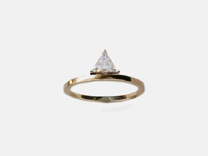 Unique trillion-cut diamond engagement ring on minimalist yellow gold band