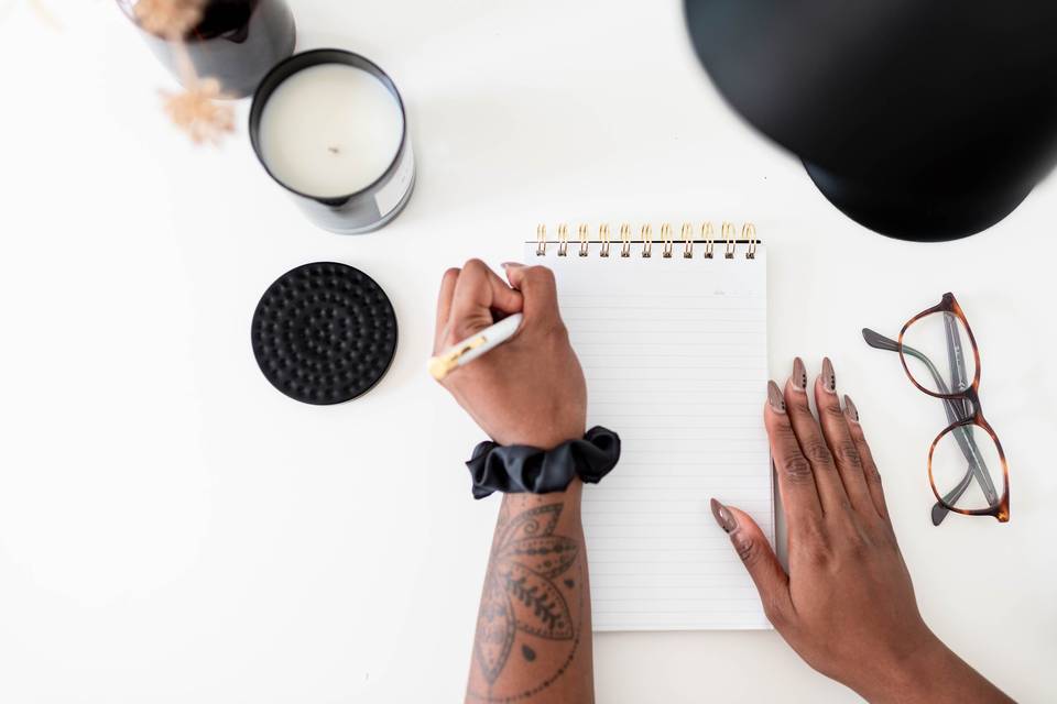 woman writing in notebook