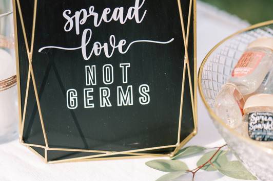 spread love not germs sign