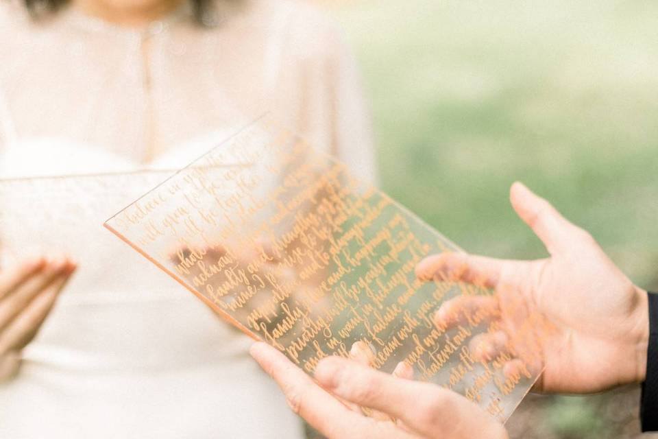 hand holding calligraphy on acrylic 