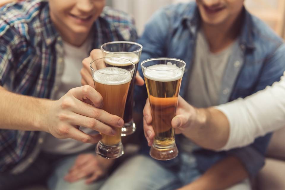 men toasting beers