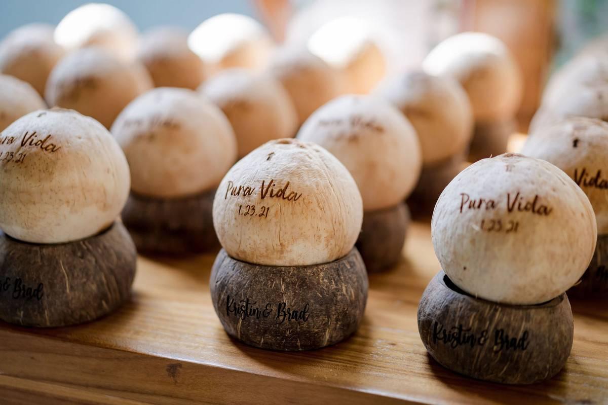 beach wedding escort cards coconuts engraved with guests' names