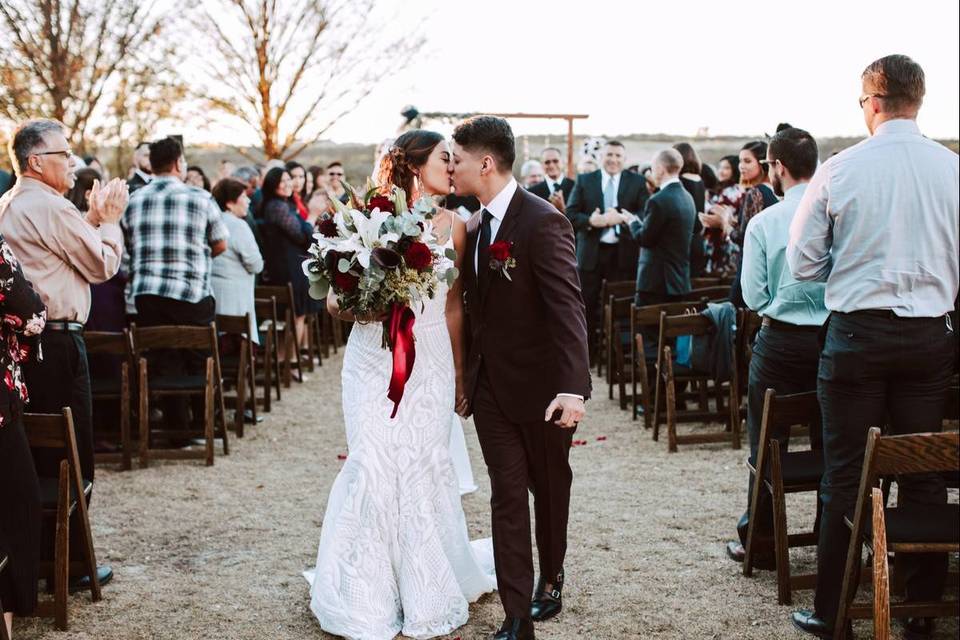 kissing at wedding recessional