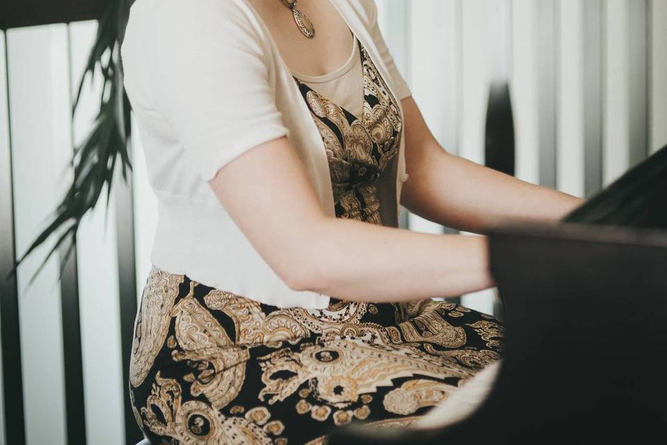 woman playing piano