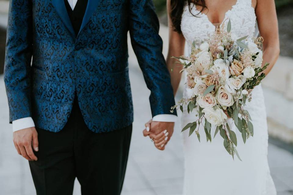 bride and groom holding hands