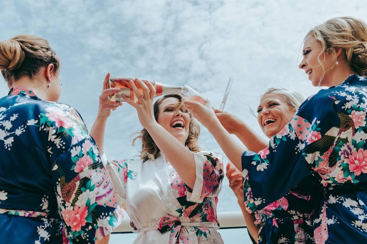 bridesmaids pouring champagne