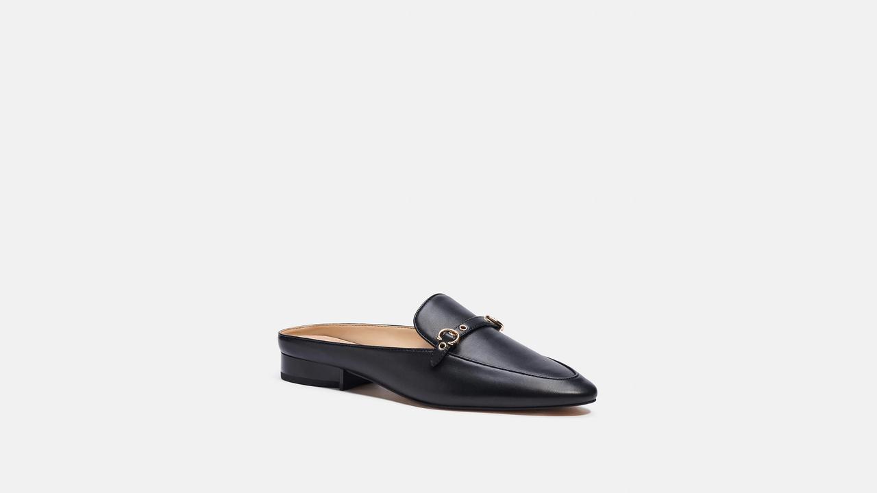 Black leather mules with gold accents