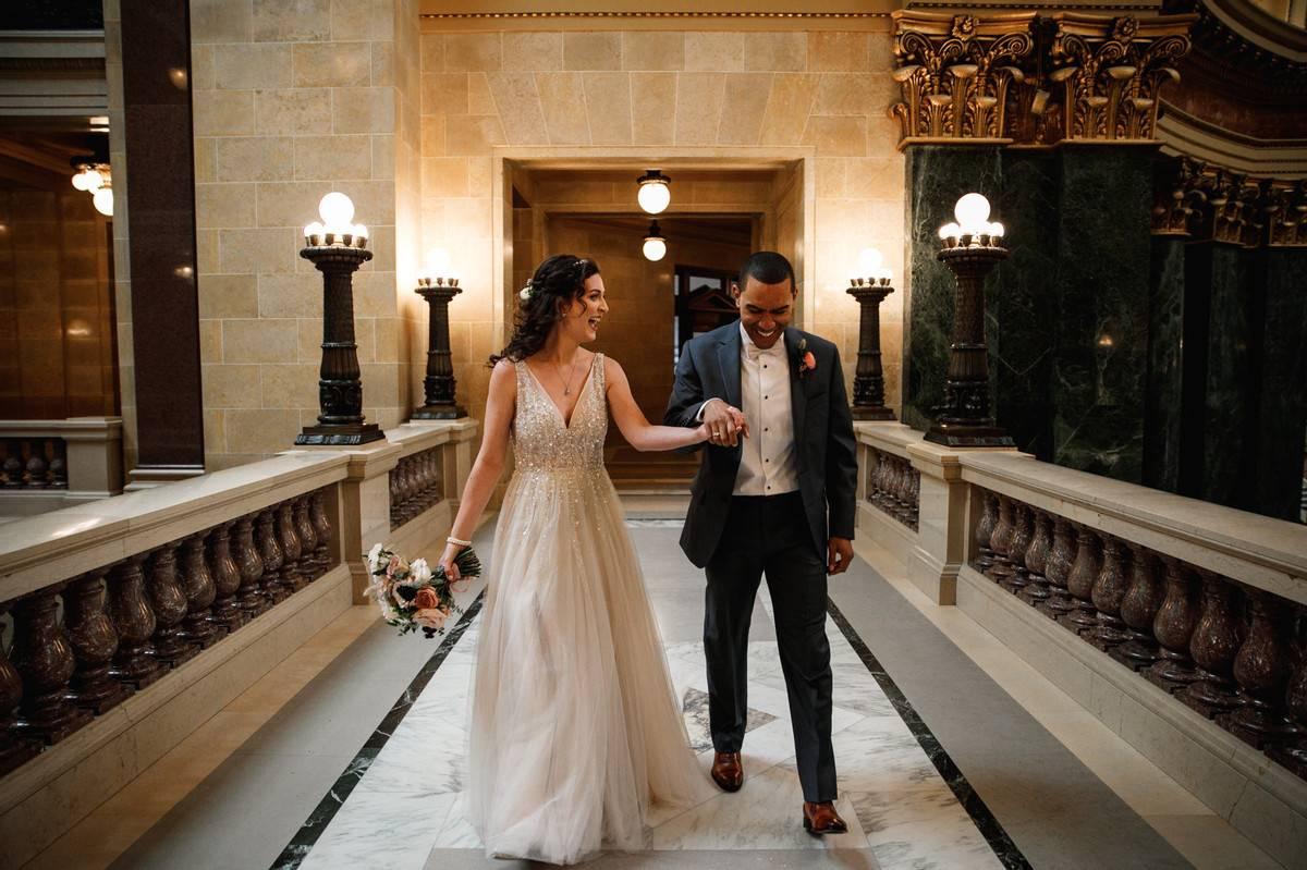 bride and groom walking and laughing together