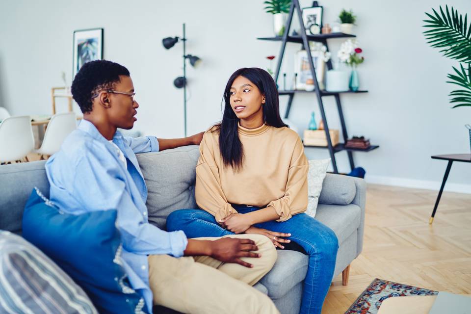 couple having a serious conversation at home