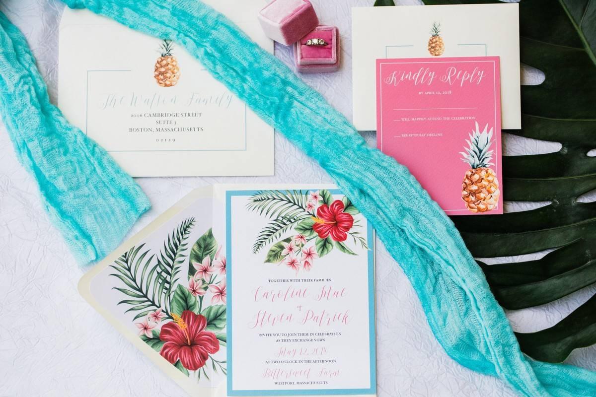 beach wedding invitations with tropical pink hibiscus and pineapple motifs 
