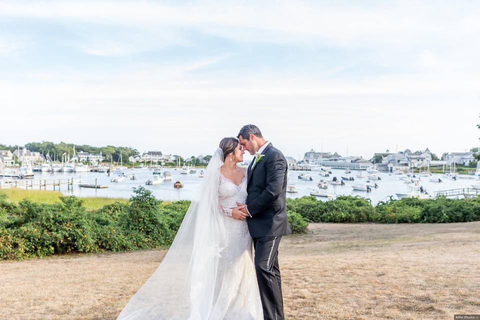 couple with boats in backgorund