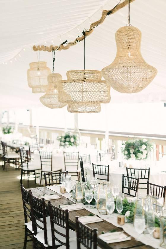 beach wedding reception decor rattan lamps hanging from driftwood chandelier