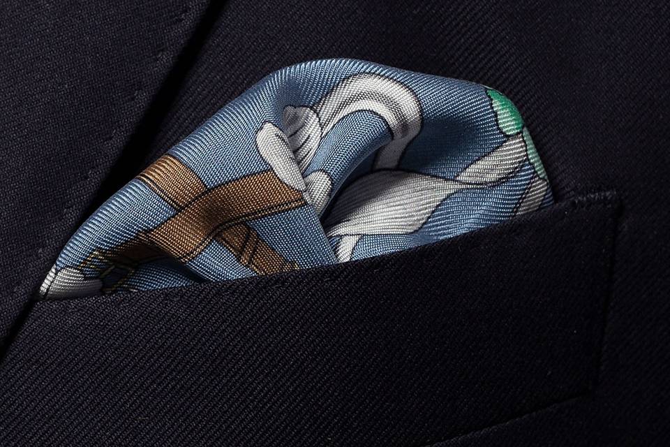 Silk blue pocket square with belt, chains and white floral pattern