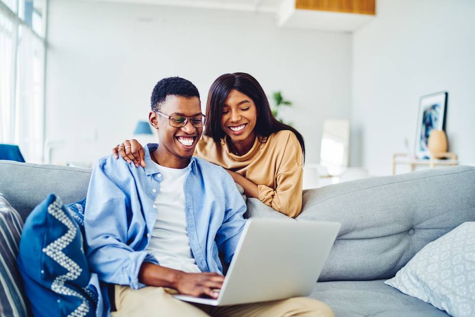 happy couple on computer