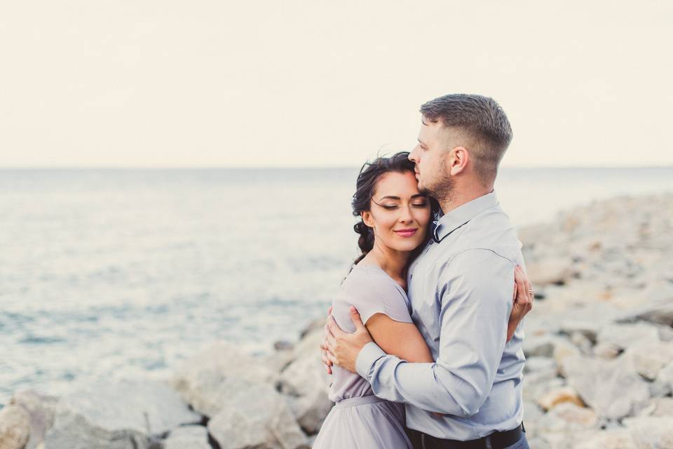 couple hugging on the beach