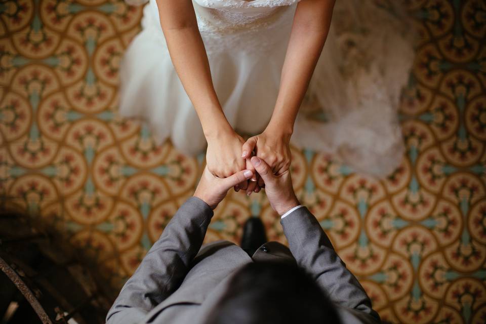 bride and groom holding hands