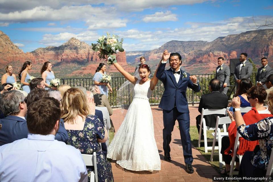 couple just married with sedona mountains as backdrop