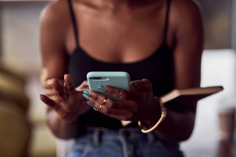 woman holding a mobile device