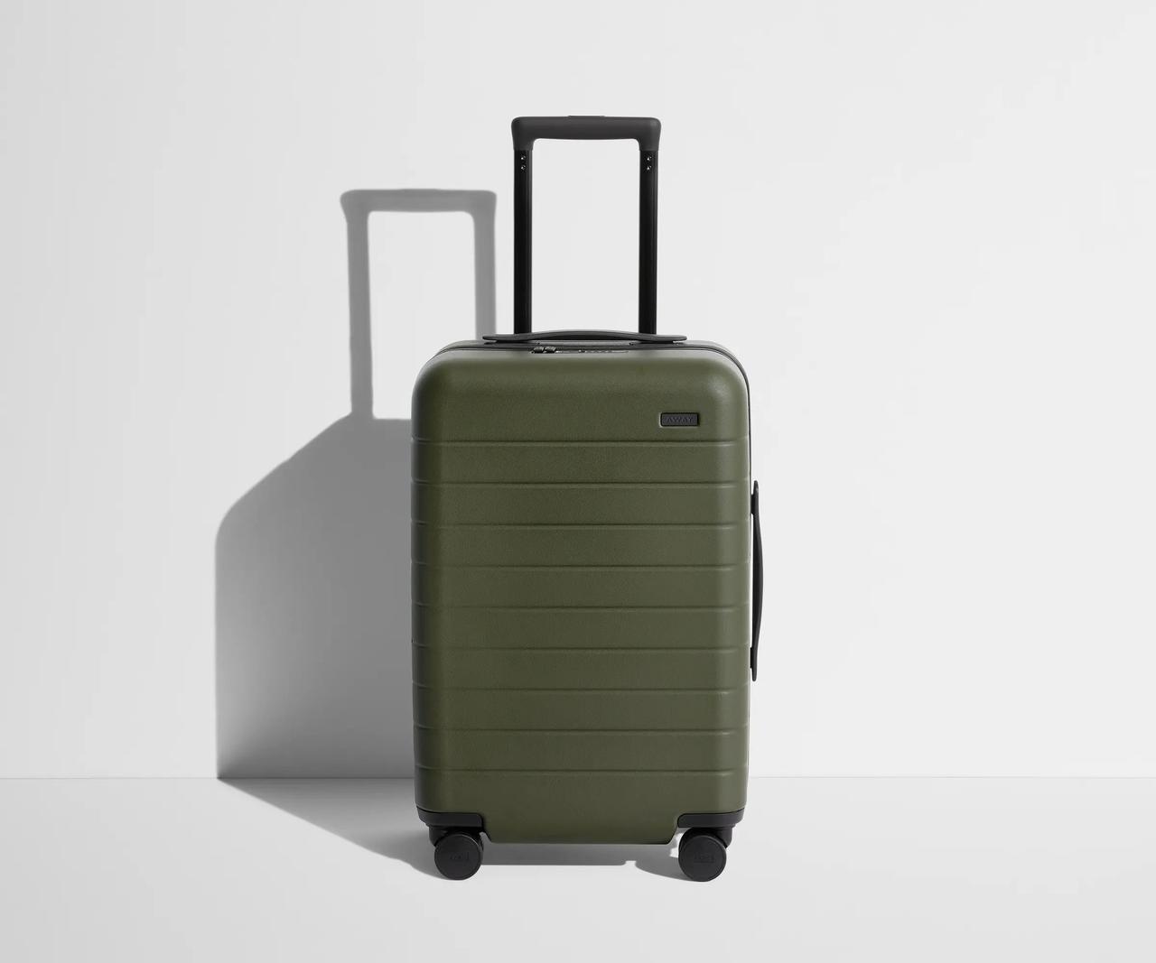 Hard carry on roller suitcase in green