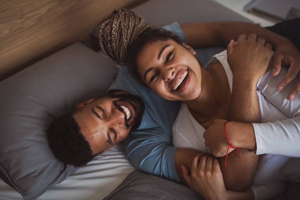 couple snuggling in bed