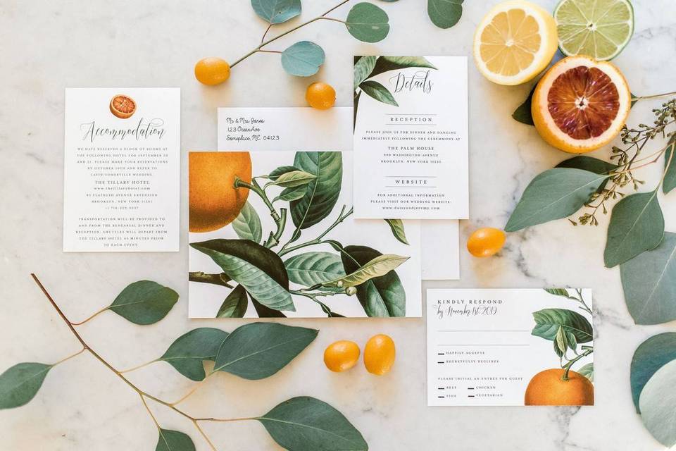 wedding invitation suite decorated with oranges